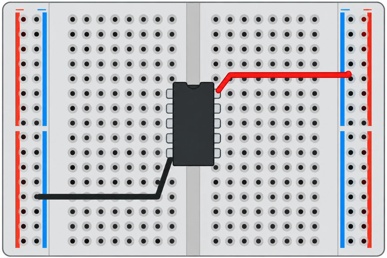 Protoboard vista de cima com o MCP6002 em PDIP-8 sobre o canal central: o pino 8 está no alto à direita e o pino 4 embaixo à esquerda, ligados a nós de alimentação distintos.