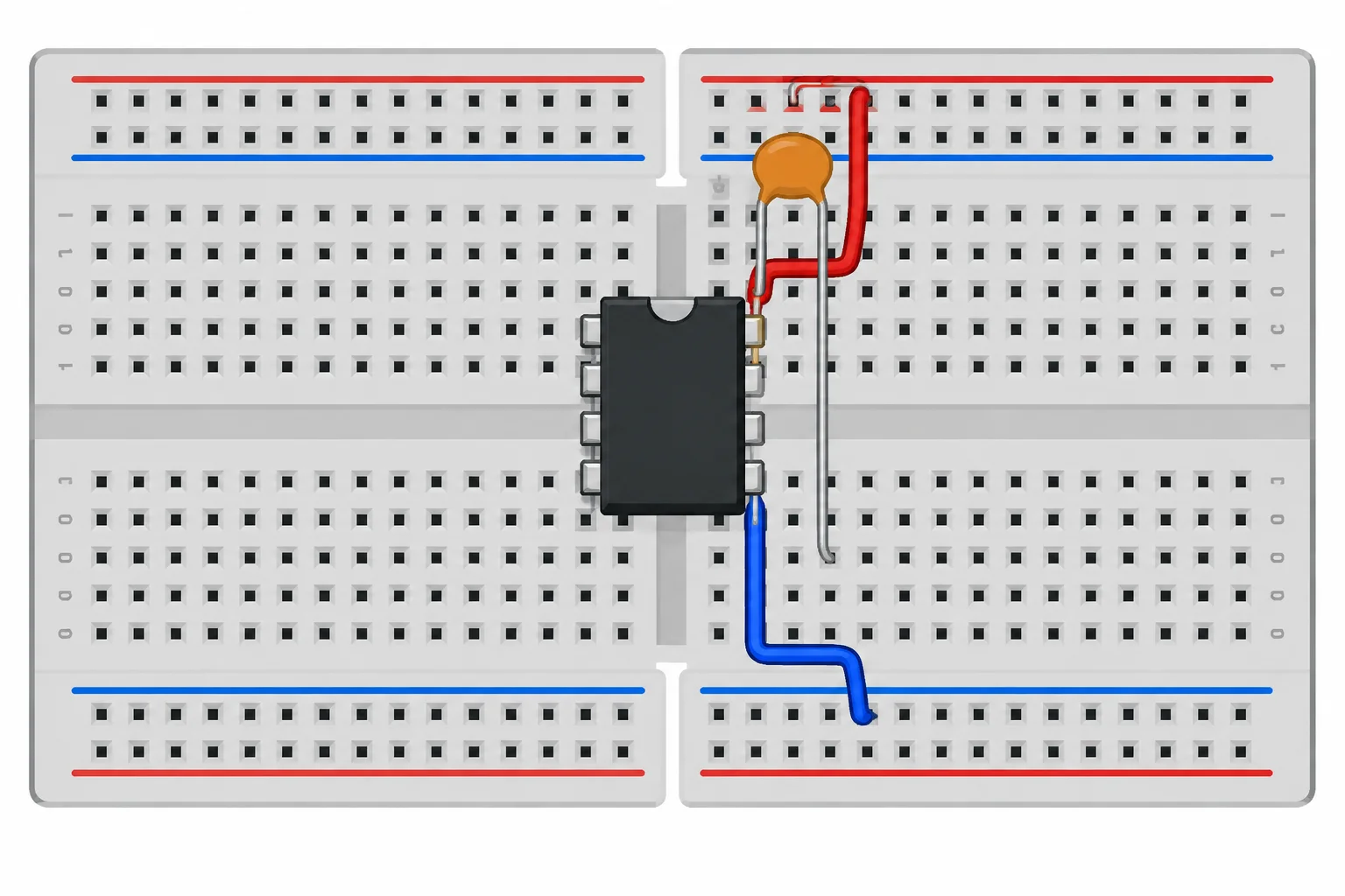 CI DIP-8 sobre o canal central da protoboard, com capacitor curto entre os pinos de alimentação e um trilho de alimentação dividido em segmentos.