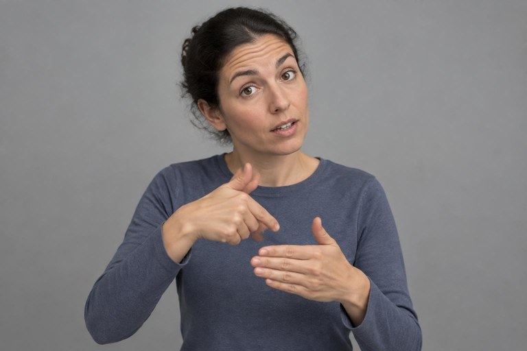 A signer with raised eyebrows marking the topic of a sentence
